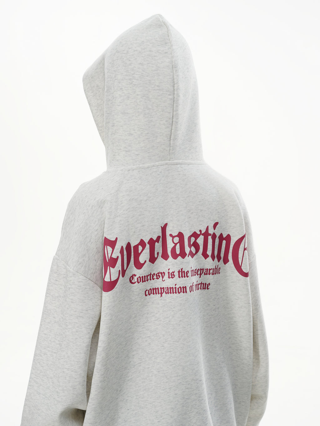 Back view of female model wearing Heather Grey hoodie showing the Everlasting slogan