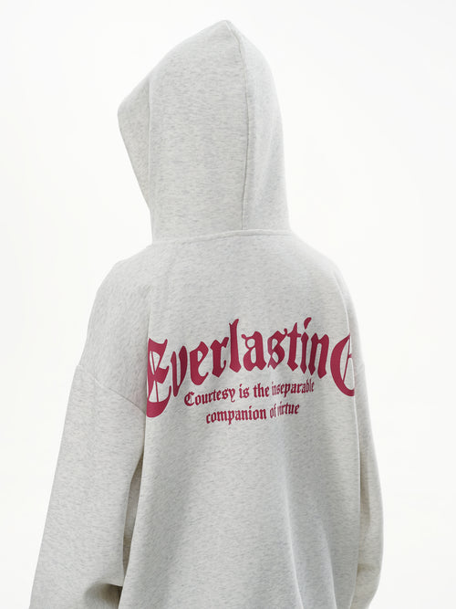 Back view of female model wearing Heather Grey hoodie showing the Everlasting slogan