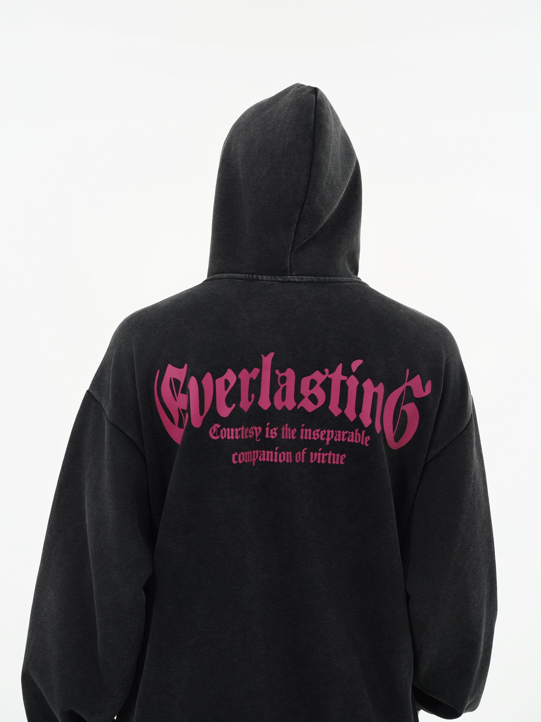 Black hoodie with pink text on the back against a white background