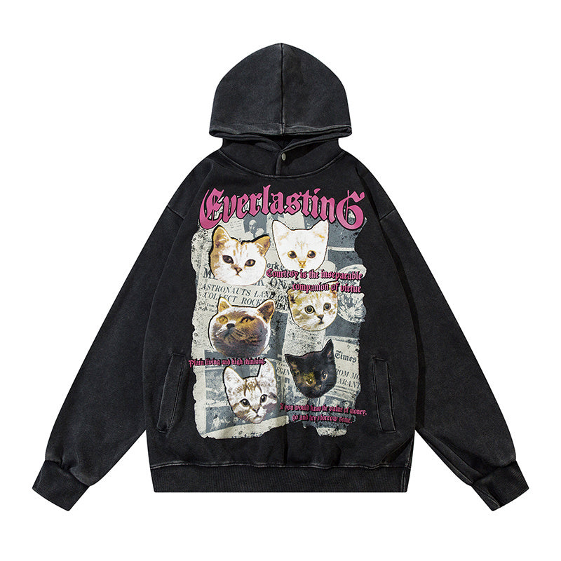 Front view of Everlasting vintage washed black hoodie with retro cat newspaper collage print