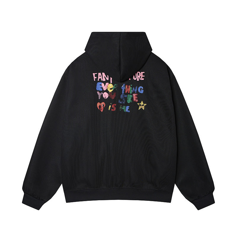 Back view of black doodle hoodie with "Everything You See Is Me" colorful slogan print.