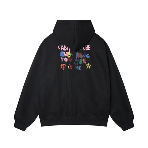 Back view of black doodle hoodie with "Everything You See Is Me" colorful slogan print.