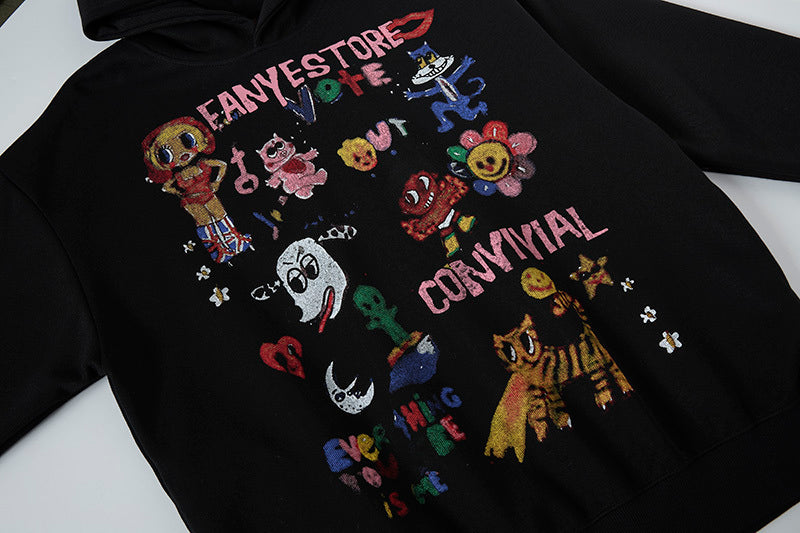 High-quality graphic print detail on black hoodie featuring hand-drawn flower and cartoon characters.