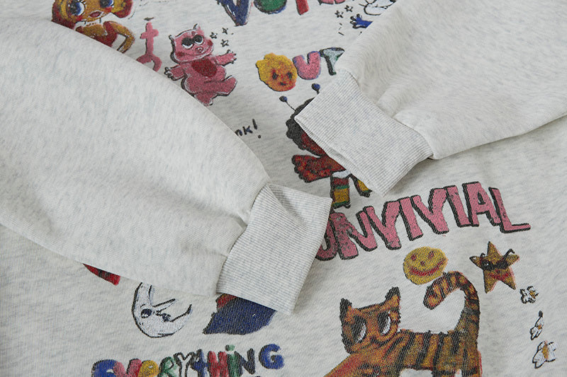 Close-up of ribbed cuff detail on heather grey graffiti hoodie with colorful doodle print.