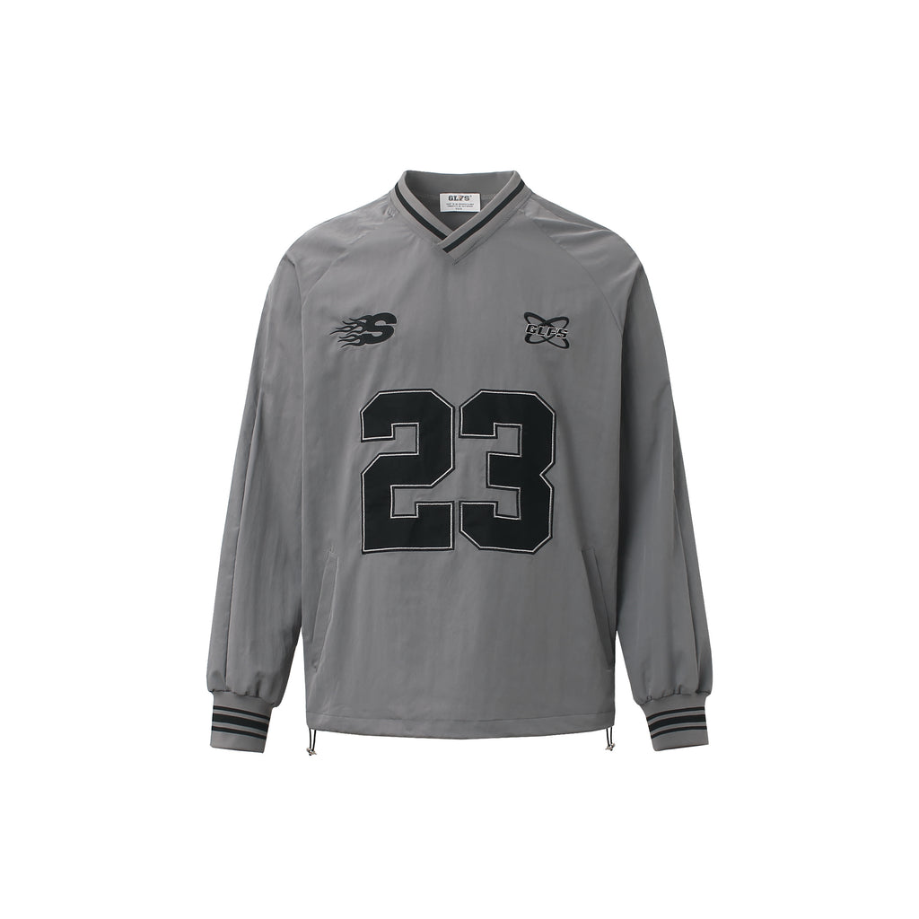 Front view of grey V-neck streetwear windbreaker with number 23 embroidery.