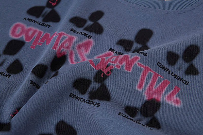 Gray sweatshirt with black and pink text design on a dark background